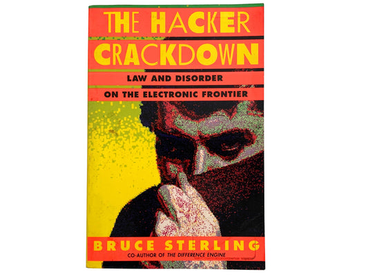 The cover of the book 'The Hacker Crackdown' by Bruce Sterling features a pixelated image of a man's face with his hand near his face, set against a yellow and red background. The book's title and author are prominently displayed at the top.